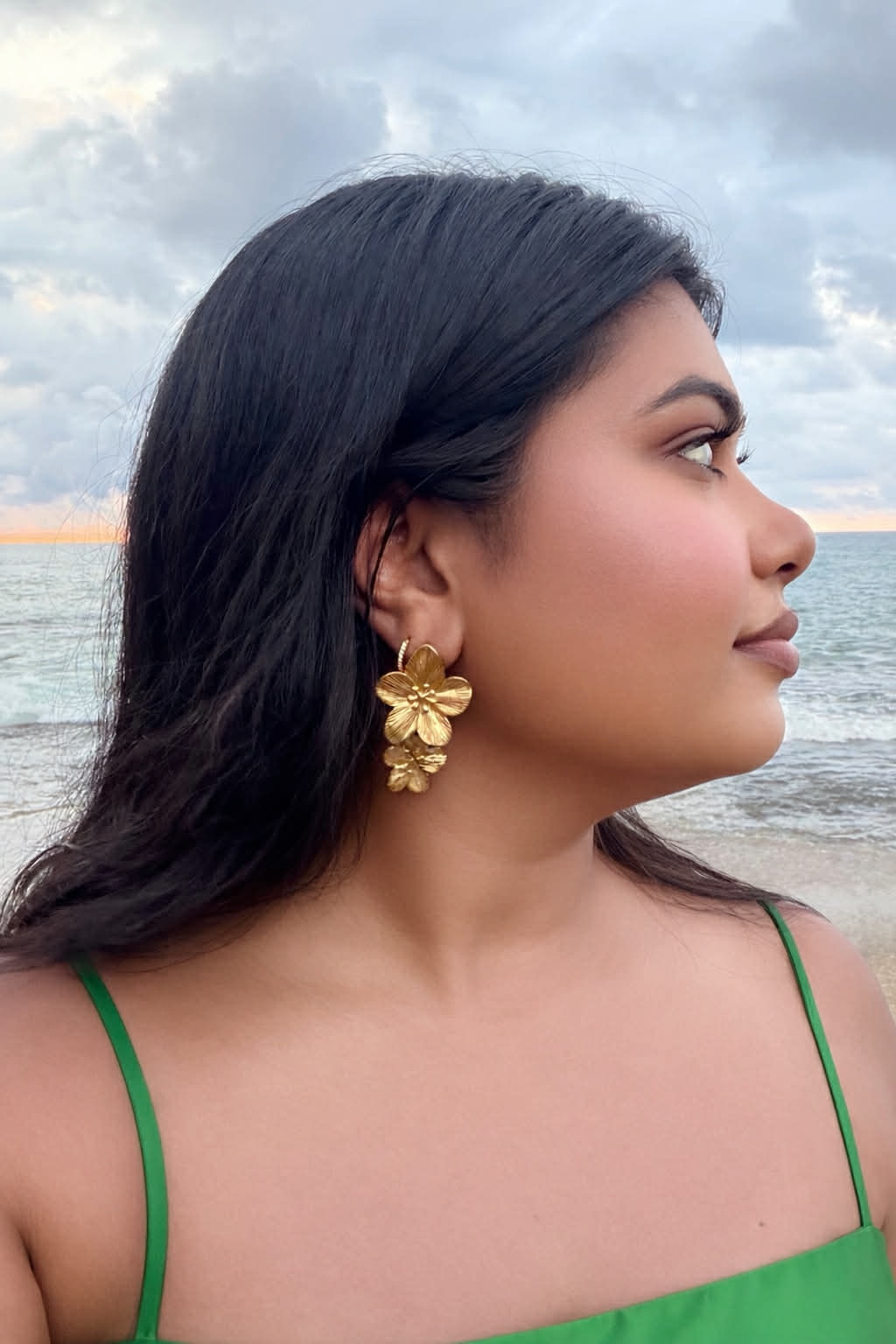 Founder wearing gold Luna and Yara earrings